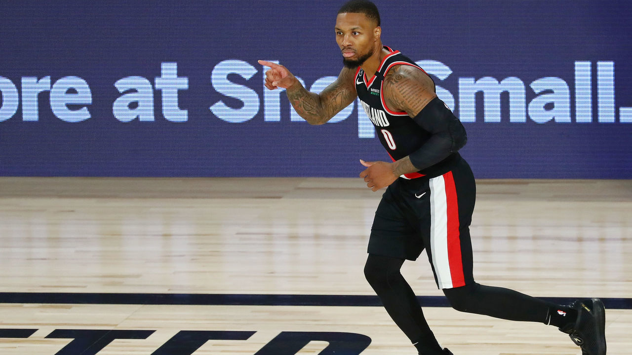 LAKE BUENA VISTA, FLORIDA - AUGUST 11: Damian Lillard #0 of the Portland Trail Blazers reacts after making a three point basket during the second half against the Dallas Mavericks at The Field House at ESPN Wide World Of Sports Complex on August 11, 2020 in Lake Buena Vista, Florida.