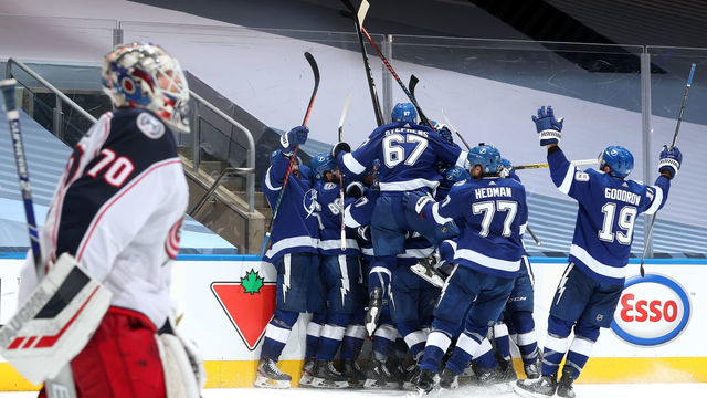 TORONTO, ONTARIO - AUGUST 11: The Tampa Bay Lightning celebrate after Brayden Point #21 scored the game winning goal at 10:27 in the fifth overtime to win 3-2 over the Columbus Blue Jackets after Game One of the Eastern Conference First Round of the 2020 NHL Stanley Cup Playoff at Scotiabank Arena on August 11, 2020 in Toronto, Ontario.
