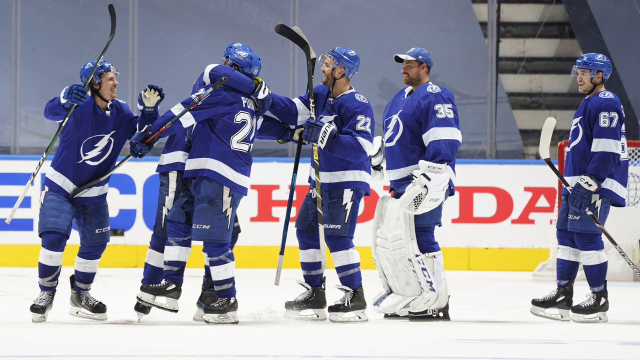 TORONTO, ONTARIO - AUGUST 11: The Tampa Bay Lightning celebrate after Brayden Point #21 scored the game winning goal at 10:27 in the fifth overtime to win 3-2 over the Columbus Blue Jackets after Game One of the Eastern Conference First Round of the 2020 NHL Stanley Cup Playoff at Scotiabank Arena on August 11, 2020 in Toronto, Ontario.