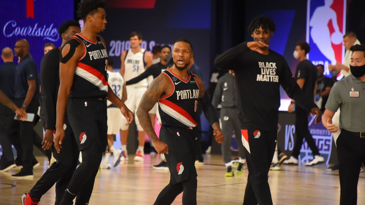Orlando, FL - AUGUST 11: Damian Lillard #0 of the Portland Trail Blazers reacts to a win against the Dallas Mavericks on August 11, 2020 at The Arena at ESPN Wide World Of Sports Complex in Orlando, Florida. NOTE TO USER: User expressly acknowledges and agrees that, by downloading and/or using this Photograph, user is consenting to the terms and conditions of the Getty Images License Agreement. Mandatory Copyright Notice: Copyright 2020 NBAE