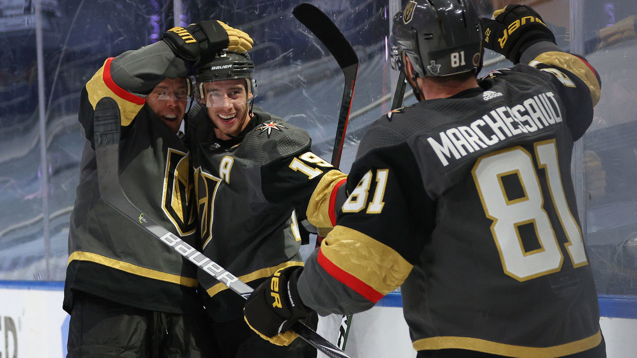 EDMONTON, ALBERTA - AUGUST 11: Reilly Smith #19 of the Vegas Golden Knights celebrates with Paul Stastny #26 and Jonathan Marchessault #81 after Smith scored his second of two goals in the third period of Game One of the Western Conference First Round of the 2020 NHL Stanley Cup Playoff against the Chicago Blackhawks at Rogers Place on August 11, 2020 in Edmonton, Alberta.