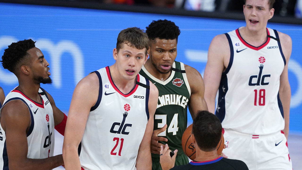 LAKE BUENA VISTA, FLORIDA - AUGUST 11: Moritz Wagner #21 of the Washington Wizards and Giannis Antetokounmpo #34 of the Milwaukee Bucks argue with the referee during the first half at Visa Athletic Center at ESPN Wide World Of Sports Complex on August 11, 2020 in Lake Buena Vista, Florida.