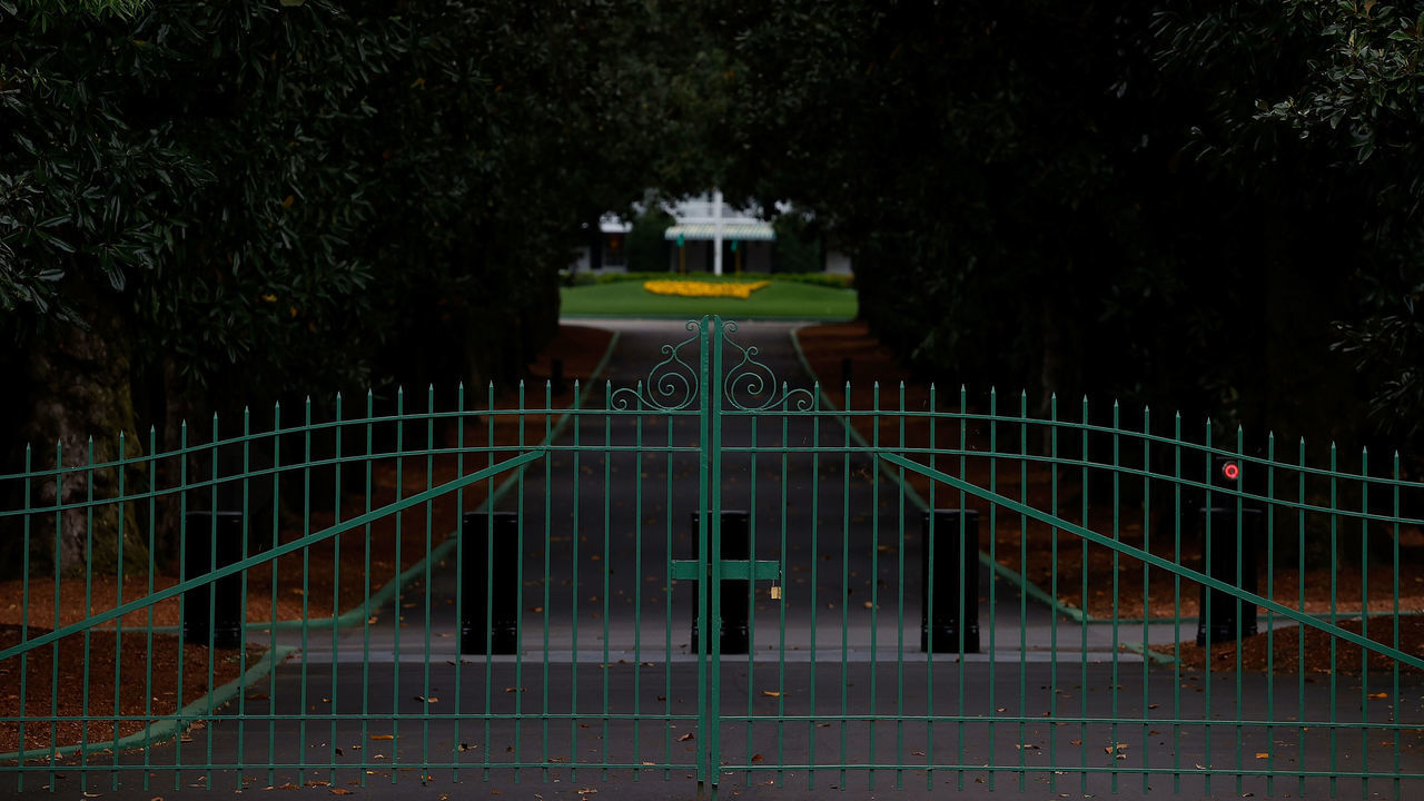 AUGUSTA, GEORGIA - MARCH 30: A view of the locked gates at the entrance of Magnolia Lane off Washington Road that leads to the clubhouse of Augusta National on March 30, 2020 in Augusta, Georgia. The Masters Tournament, the Augusta National Women’s Amateur and the Drive, Chip and Putt National Finals has been postponed due to the coronavirus (COVID-19) outbreak.