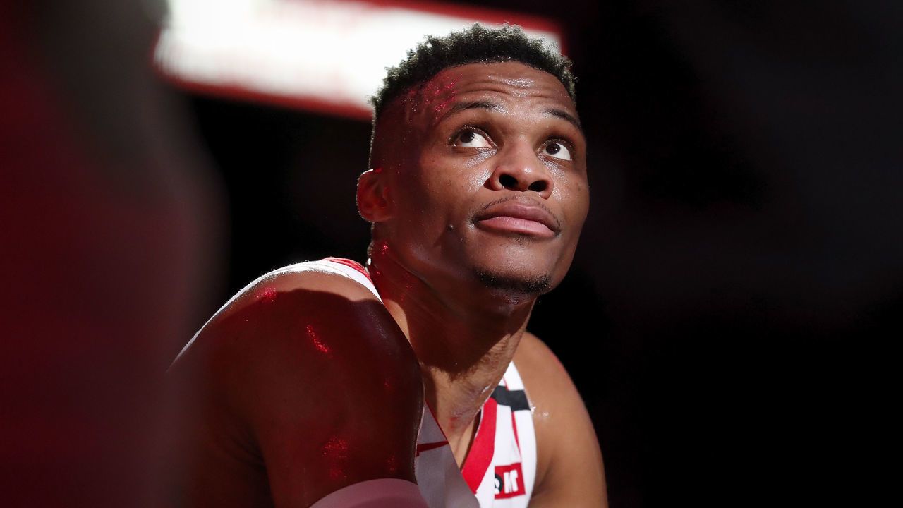 HOUSTON, TEXAS - MARCH 08: Russell Westbrook #0 of the Houston Rockets reacts on the bench in the first half against the Orlando Magic at Toyota Center on March 08, 2020 in Houston, Texas.