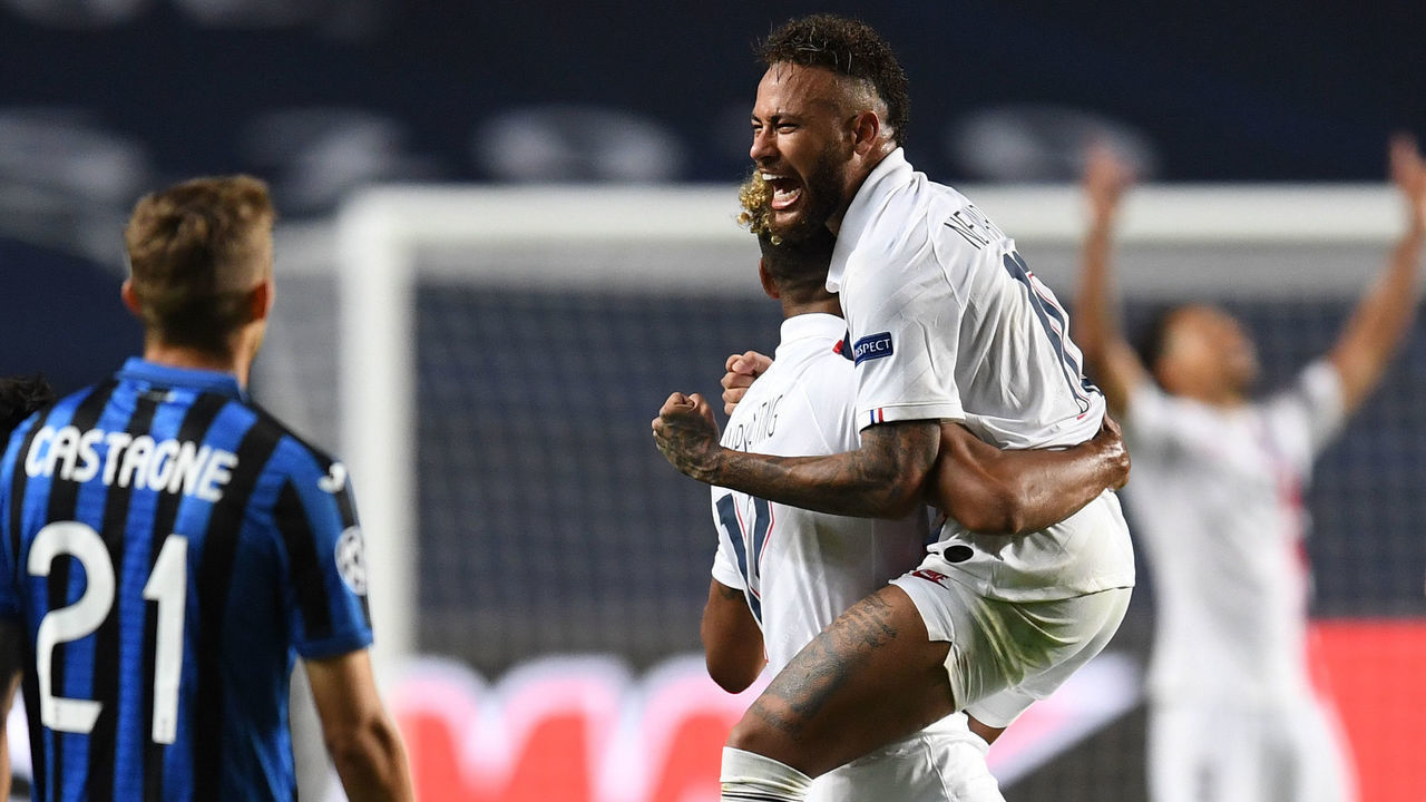 Paris Saint-Germain's Cameroon forward Eric Maxim Choupo-Moting (C) celebrates with Paris Saint-Germain's Brazilian forward Neymar after scoring a goal during the UEFA Champions League quarter-final football match between Atalanta and Paris Saint-Germain at the Luz Stadium in Lisbon on August 12, 2020.