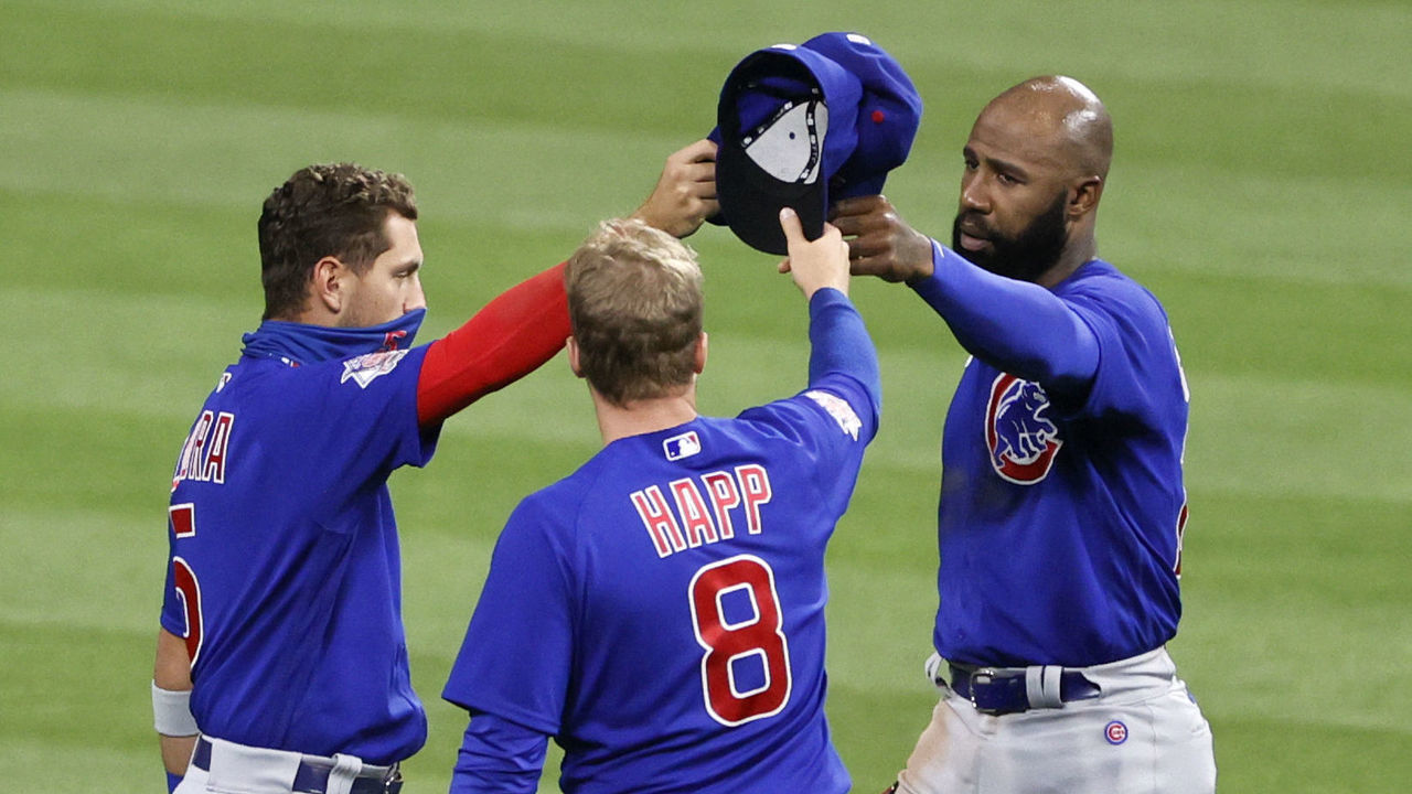 CLEVELAND, OH - AUGUST 12: Albert Almora #5, Ian Happ #8 and Jason Heyward #22 of the Chicago Cubs celebrate a 7-2 victory over the Cleveland Indians at Progressive Field on August 12, 2020 in Cleveland, Ohio.