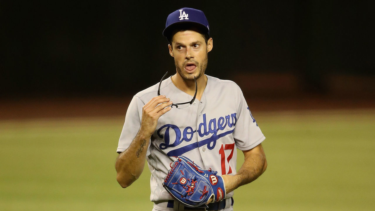 PHOENIX, ARIZONA - JULY 30: Relief pitcher Joe Kelly #17 of the Los Angeles Dodgers reacts as he pitches against the Arizona Diamondbacks during the seventh inning of the MLB game at Chase Field on July 30, 2020 in Phoenix, Arizona.