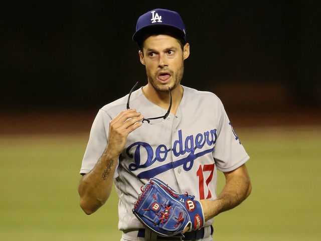 PHOENIX, ARIZONA - JULY 30: Relief pitcher Joe Kelly #17 of the Los Angeles Dodgers reacts as he pitches against the Arizona Diamondbacks during the seventh inning of the MLB game at Chase Field on July 30, 2020 in Phoenix, Arizona.