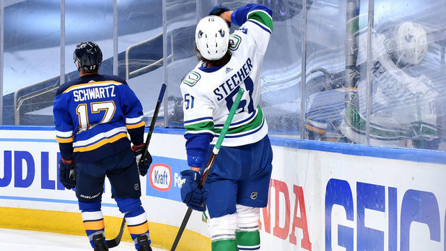 EDMONTON, ALBERTA - AUGUST 12: Troy Stecher #51 of the Vancouver Canucks gestures in celebration after scoring a goal against the St. Louis Blues during the third period of Game One of the Western Conference First Round of the 2020 NHL Stanley Cup Playoff at Rogers Place on August 12, 2020 in Edmonton, Alberta.