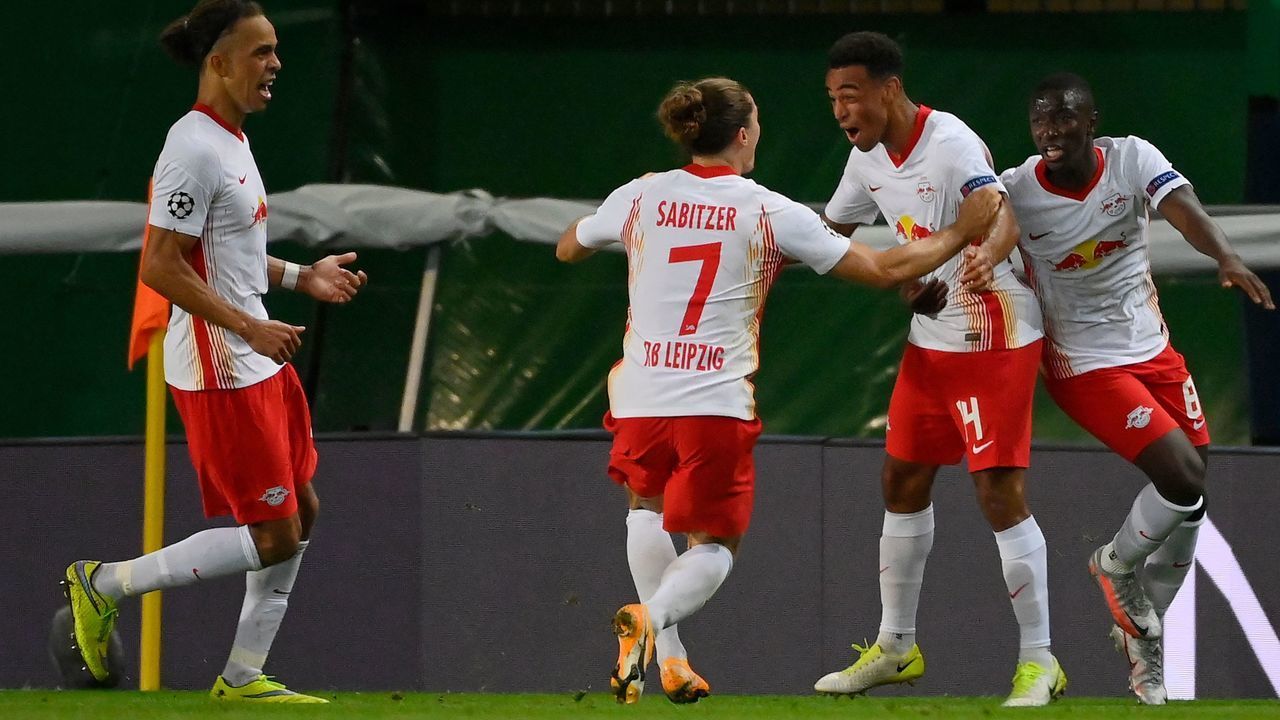 Leipzig's US midfielder Tyler Adams (2R) celebrates after scoring a goal during the UEFA Champions League quarter-final football match between Leipzig and Atletico Madrid at the Jose Alvalade stadium in Lisbon on August 13, 2020.