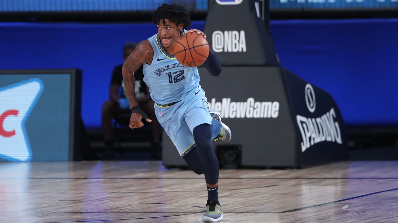Orlando, FL - AUGUST 13: Ja Morant #12 of the Memphis Grizzlies handles the ball during the game against the Milwaukee Bucks on August 13, 2020 at The Visa Athletic Center at ESPN Wide World Of Sports Complex in Reunion, Florida. NOTE TO USER: User expressly acknowledges and agrees that, by downloading and/or using this Photograph, user is consenting to the terms and conditions of the Getty Images License Agreement. Mandatory Copyright Notice: Copyright 2020 NBAE