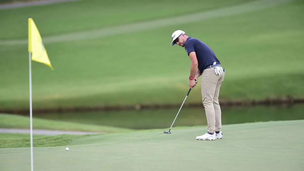 GREENSBORO, NORTH CAROLINA - AUGUST 13: Roger Sloan of Canada putts on the 15th green during the first round of the Wyndham Championship at Sedgefield Country Club on August 13, 2020 in Greensboro, North Carolina.