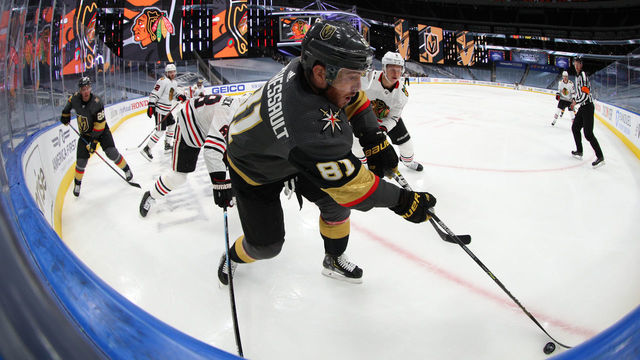 EDMONTON, ALBERTA - AUGUST 13: Jonathan Marchessault #81 of the Vegas Golden Knights plays the puck in the corner against Olli Maatta #6 of the Chicago Blackhawks in the third period of Game Two of the Western Conference First Round of the 2020 NHL Stanley Cup Playoff at Rogers Place on August 13, 2020 in Edmonton, Alberta.