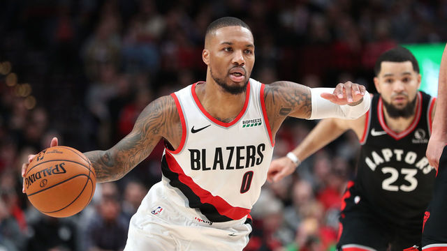 PORTLAND, OREGON - NOVEMBER 13: Damian Lillard #0 of the Portland Trail Blazers dribbles with the ball against the Toronto Raptors in the fourth quarter during their game at Moda Center on November 13, 2019 in Portland, Oregon.