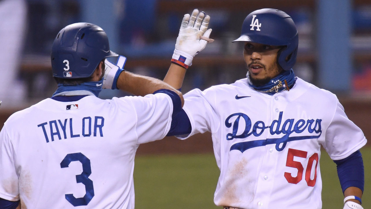 LOS ANGELES, CALIFORNIA - AUGUST 13: Mookie Betts #50 of the Los Angeles Dodgers celebrates his two run homerun with Chris Taylor #3, his third of the evening, to take an 11-2 lead over the San Diego Padres, during the fifth inning at Dodger Stadium on August 13, 2020 in Los Angeles, California.