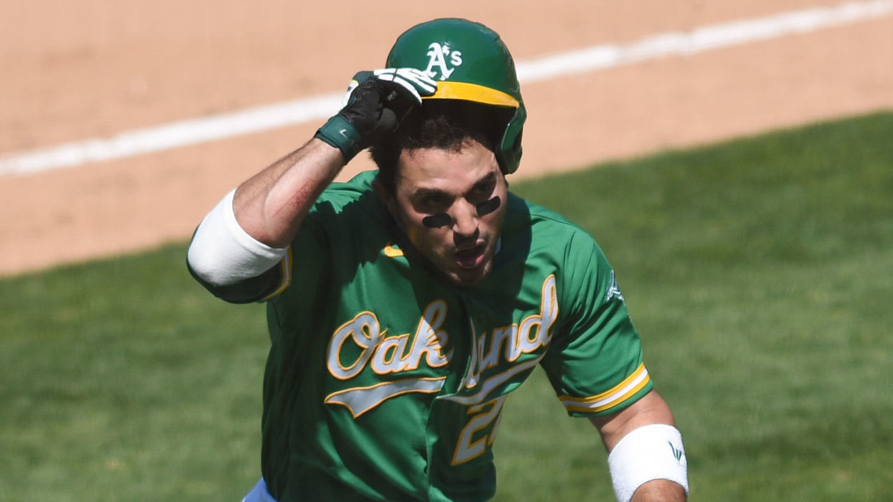 OAKLAND, CA - AUGUST 09: Oakland Athletics center fielder Ramon Laureano (22) rushes the Houston Astros bench during the Major League Baseball game between the Houston Astros and the Oakland Athletics on August 9, 2020 at RingCentral Coliseum in Oakland, CA.