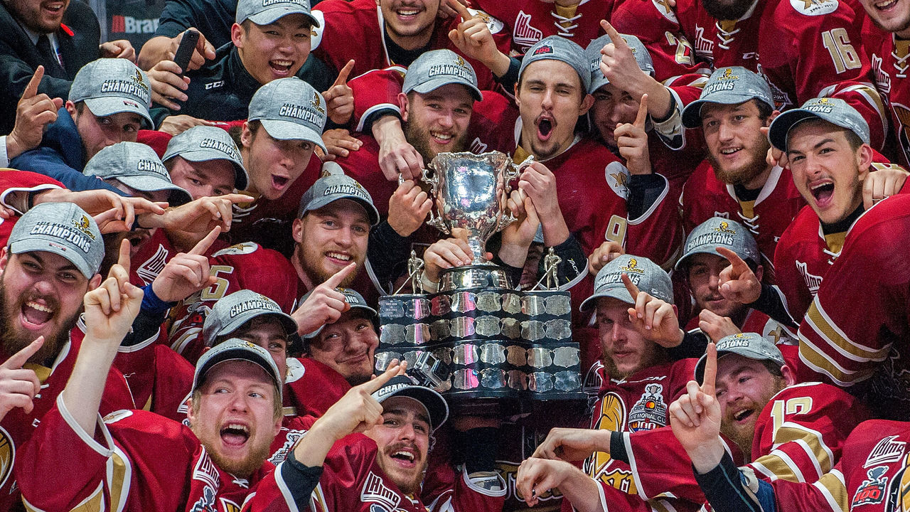 REGINA, SK - MAY 27: The Acadie-Bathurst Titan gather around the Memorial Cup and celebrate the win against the Regina Pats at Brandt Centre - Evraz Place on May 27, 2018 in Regina, Canada.