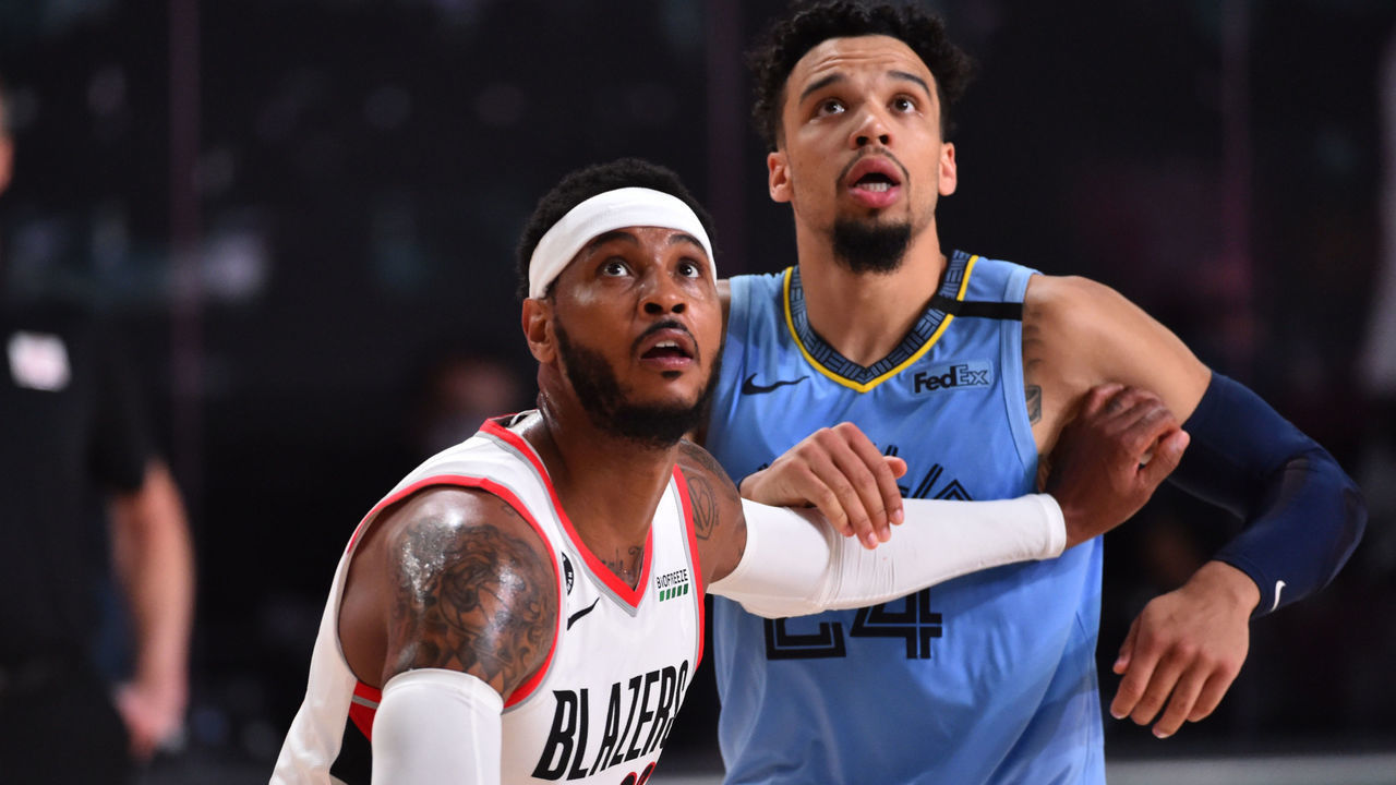 Orlando, FL - JULY 31: Carmelo Anthony #00 of the Portland Trail Blazers and Dillon Brooks #24 of the Memphis Grizzlies fight for the rebound on July 31, 2020 at The Arena at ESPN Wide World Of Sports Complex in Orlando, Florida. NOTE TO USER: User expressly acknowledges and agrees that, by downloading and/or using this Photograph, user is consenting to the terms and conditions of the Getty Images License Agreement. Mandatory Copyright Notice: Copyright 2020 NBAE