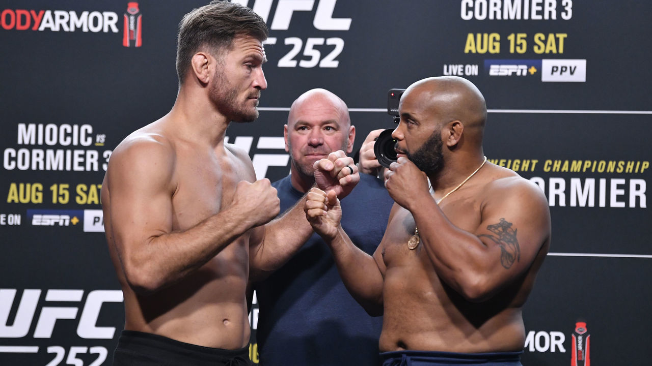 LAS VEGAS, NEVADA - AUGUST 14: In this handout image provided by UFC, (L-R) Opponents Stipe Miocic and Daniel Cormier face off during the UFC 252 weigh-in at UFC APEX on August 14, 2020 in Las Vegas, Nevada.