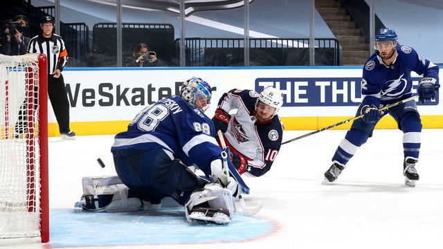 TORONTO, ONTARIO - AUGUST 13: Kevin Shattenkirk #22 of the Tampa Bay Lightning can only watch as Alexander Wennberg #10 of the Columbus Blue Jackets scores a goal on goaltender Andrei Vasilevskiy #88 during the third period of Game Two of the Eastern Conference First Round of the 2020 NHL Stanley Cup Playoff at Scotiabank Arena on August 13, 2020 in Toronto, Ontario.