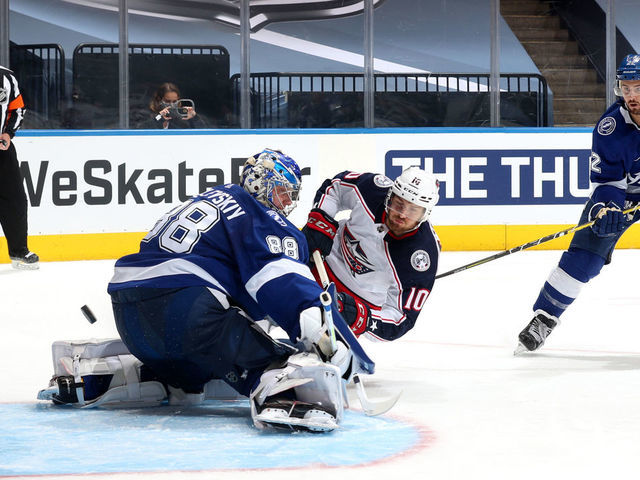 TORONTO, ONTARIO - AUGUST 13: Kevin Shattenkirk #22 of the Tampa Bay Lightning can only watch as Alexander Wennberg #10 of the Columbus Blue Jackets scores a goal on goaltender Andrei Vasilevskiy #88 during the third period of Game Two of the Eastern Conference First Round of the 2020 NHL Stanley Cup Playoff at Scotiabank Arena on August 13, 2020 in Toronto, Ontario.