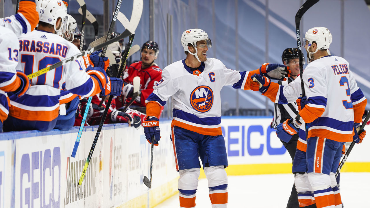 TORONTO, ONTARIO - AUGUST 14: Anders Lee #27 of the New York Islanders celebrates his goal against the Washington Capitals with teammate Adam Pelech #3 during the third period in Game Two of the Eastern Conference First Round of the 2020 NHL Stanley Cup Playoff at Scotiabank Arena on August 14, 2020 in Toronto, Ontario.