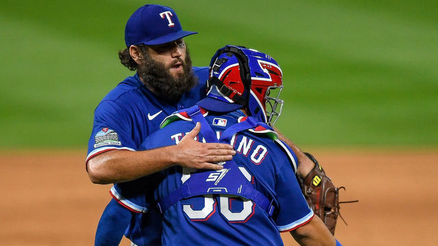 DENVER, CO - AUGUST 14: Lance Lynn #35 of the Texas Rangers hugs Jose Trevino #56 of the Texas Rangers after the final out of his complete game against the Colorado Rockies celebrate the final out of his complete game against the Colorado Rockies at Coors Field on August 14, 2020 in Denver, Colorado.