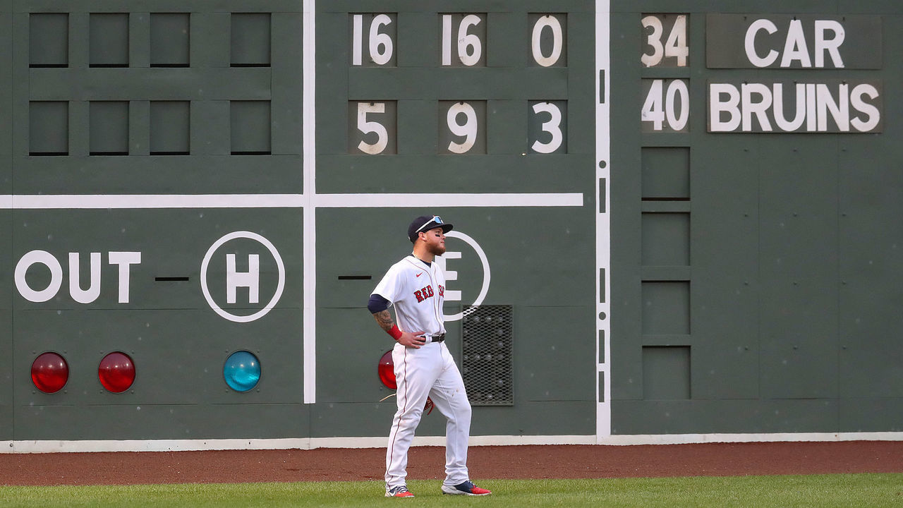 BOSTON - AUGUST 13: Boston Red Sox left fielder Alex Verdugo walks past the ugly score board in the 7th inning with the Sox down 16-5. The Boston Red Sox host the Tampa Bay Rays in a regular season MLB baseball game at Fenway Park in Boston during the coronavirus pandemic on Aug. 13, 2020.