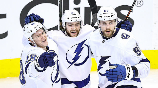 TORONTO, ONTARIO - AUGUST 15: Brayden Point #21 of the Tampa Bay Lightning is congratulated by his teammates, Ondrej Palat #18 and Erik Cernak #81 after scoring a goal against the Columbus Blue Jackets during the second period in Game Three of the Eastern Conference First Round during the 2020 NHL Stanley Cup Playoffs at Scotiabank Arena on August 15, 2020 in Toronto, Ontario.