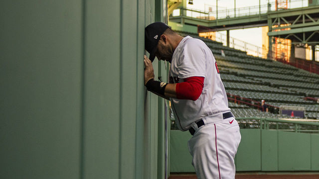 BOSTON, MA - AUGUST 12: J.D. Martinez #28 of the Boston Red Sox pauses in the outfield before a game against the Tampa Bay Rays on August 12, 2020 at Fenway Park in Boston, Massachusetts. The 2020 season had been postponed since March due to the COVID-19 pandemic.