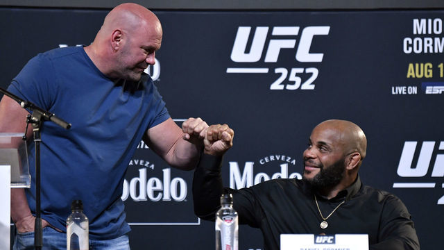 LAS VEGAS, NEVADA - AUGUST 13: (R-L) Daniel Cormier and UFC president Dana White interact during the UFC 252 press conference at UFC APEX on August 13, 2020 in Las Vegas, Nevada.