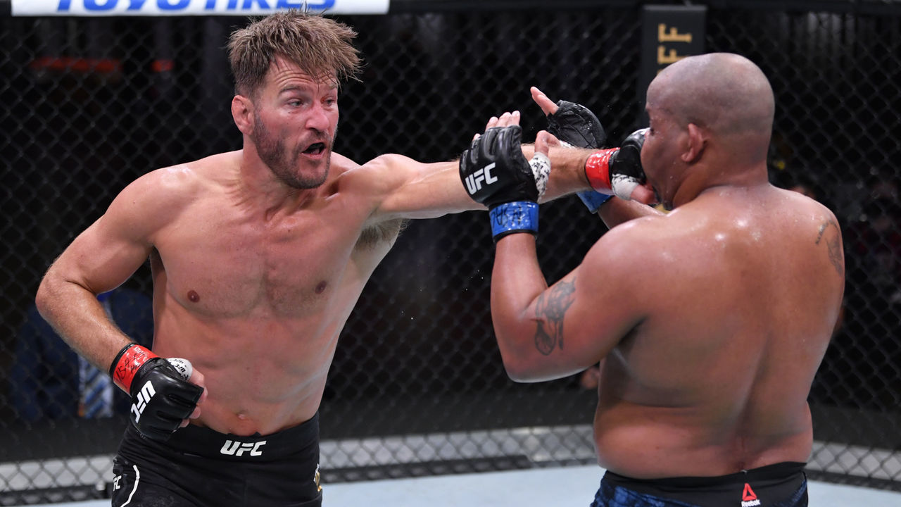 LAS VEGAS, NEVADA - AUGUST 15: (L-R) Stipe Miocic punches Daniel Cormier in their UFC heavyweight championship bout during the UFC 252 event at UFC APEX on August 15, 2020 in Las Vegas, Nevada.