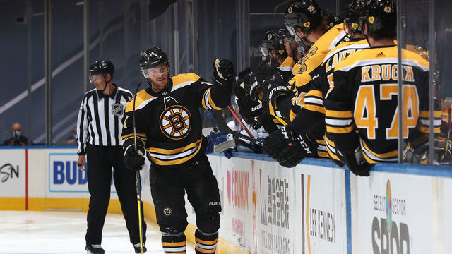 TORONTO, ONTARIO - AUGUST 05: Chris Wagner #14 of the Boston Bruins skates by the bench to celebrate with teammates after Wagner scored in the third period of a Round Robin game against the Tampa Bay Lightning during the 2020 NHL Stanley Cup Playoff at Scotiabank Arena on August 05, 2020 in Toronto, Ontario.
