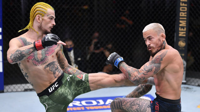 LAS VEGAS, NEVADA - AUGUST 15: (L-R) Sean O'Malley kicks Marlon Vera of Ecuador in their bantamweight bout during the UFC 252 event at UFC APEX on August 15, 2020 in Las Vegas, Nevada.