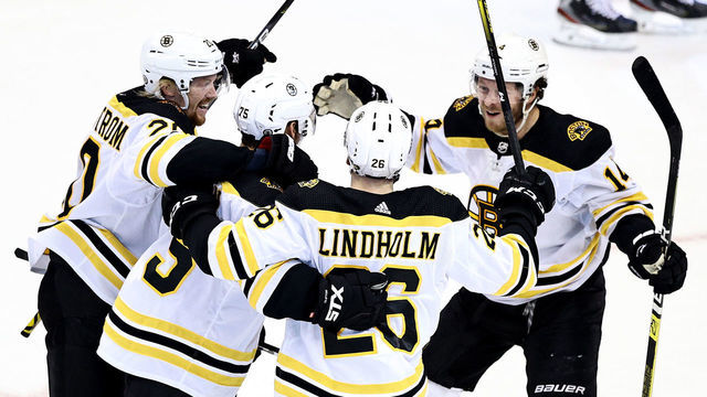 TORONTO, ONTARIO - AUGUST 17: Connor Clifton #75 of the Boston Bruins is congratulated by his teammates after scoring a goal against the Carolina Hurricanes during the third period in Game Four of the Eastern Conference First Round during the 2020 NHL Stanley Cup Playoffs at Scotiabank Arena on August 17, 2020 in Toronto, Ontario.