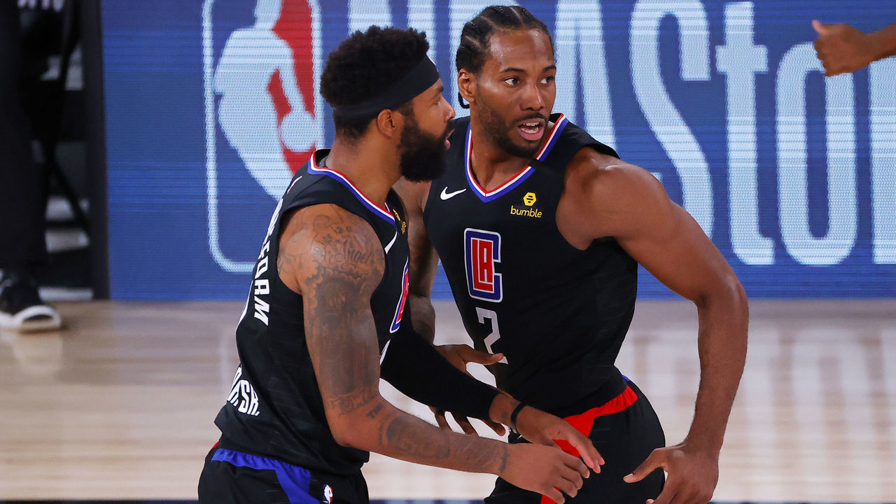 LAKE BUENA VISTA, FLORIDA - AUGUST 17: Kawhi Leonard #2 of the LA Clippers reacts with Marcus Morris Sr. #31 after hiting a jump shot against the Dallas Mavericks during the fourth quarter in Game One of the Western Conference First Round during the 2020 NBA Playoffs at AdventHealth Arena at ESPN Wide World Of Sports Complex on August 17, 2020 in Lake Buena Vista, Florida.