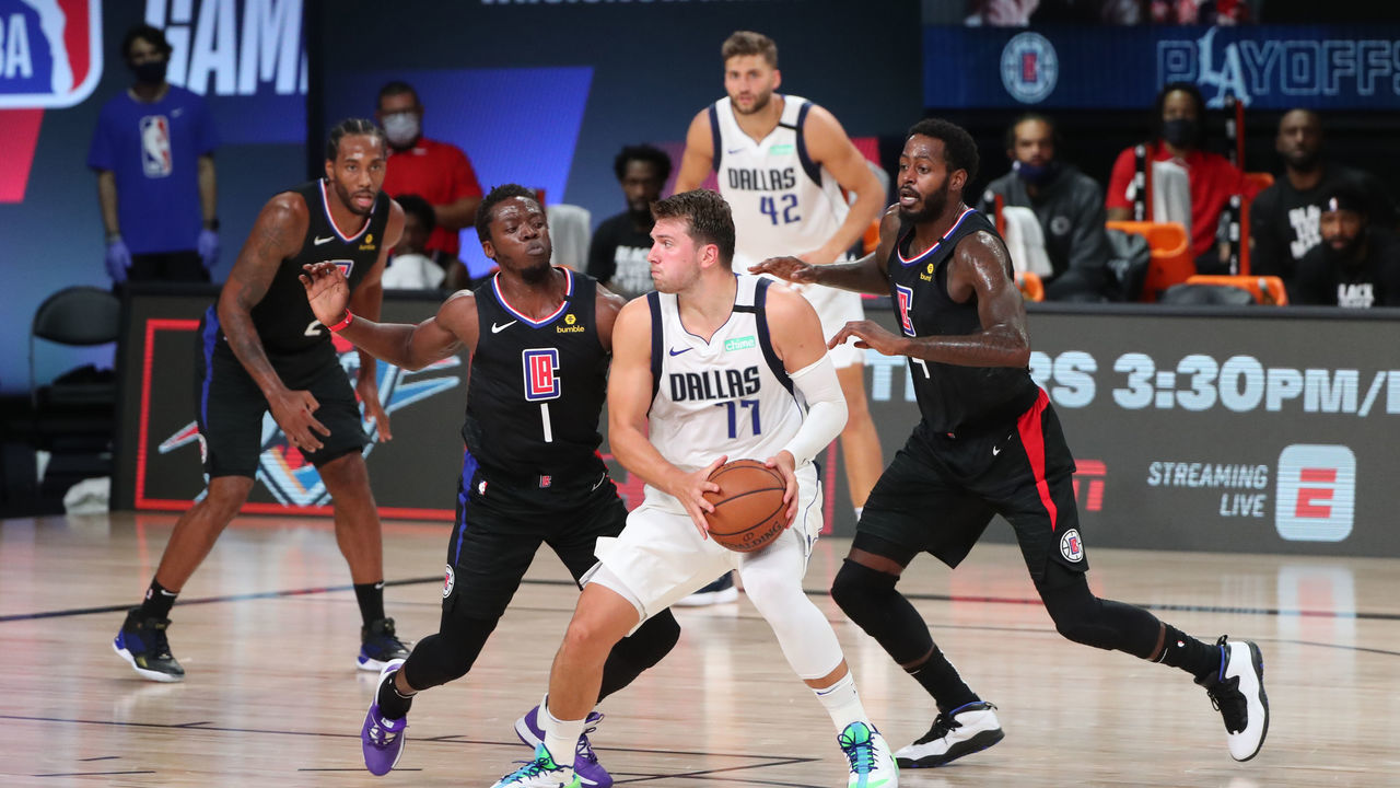 ORLANDO, FL - AUGUST 17: Luka Doncic #77 of the Dallas Mavericks handles the ball against the LA Clippers during Round One, Game One of the NBA Playoffs on August 17, 2020 at AdventHealth Arena in Orlando, Florida. NOTE TO USER: User expressly acknowledges and agrees that, by downloading and/or using this Photograph, user is consenting to the terms and conditions of the Getty Images License Agreement. Mandatory Copyright Notice: Copyright 2020 NBAE