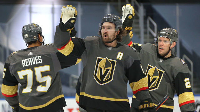 EDMONTON, ALBERTA - AUGUST 13: Ryan Reaves #75, Mark Stone #61 and Paul Stastny #26 of the Vegas Golden Knights celebrate after Reilly Smith #19 scored the game-winning goal in the first overtime period of Game Two of the Western Conference First Round of the 2020 NHL Stanley Cup Playoff against the Chicago Blackhawks at Rogers Place on August 13, 2020 in Edmonton, Alberta.