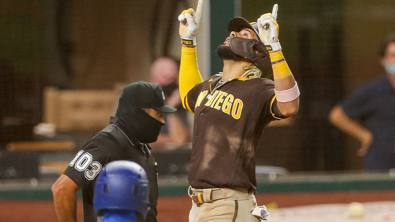 ARLINGTON, TX - AUGUST 17: San Diego Padres second baseman Fernando Tatis Jr. (23) hits a grand slam homer during the MLB game between the San Diego Padres and Texas Rangers on August 17, 2020 at Globe Life Field in Arlington, TX.