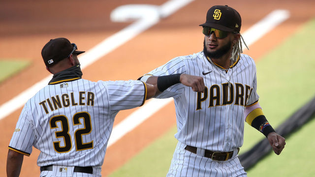 SAN DIEGO, CALIFORNIA - JULY 24: Manager Jayce Tingler and Fernando Tatis Jr. #23 of the San Diego Padres elbow bump as the starting lineups are announced prior to the Opening Day game against the Arizona Diamondbacks at PETCO Park on July 24, 2020 in San Diego, California.