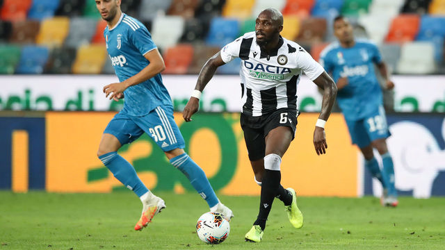 UDINE, ITALY - JULY 23: Seko Fofana of Udinese Calcio carries the ball forwards as Rodrigo Bentancur of Juventus looks onduring the Serie A match between Udinese Calcio and Juventus at Stadio Friuli on July 23, 2020 in Udine, Italy.