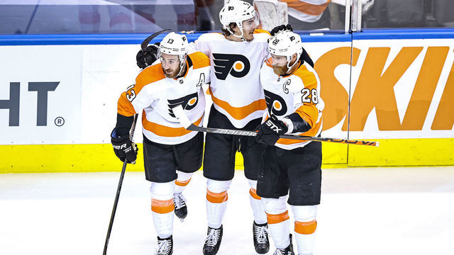 TORONTO, ONTARIO - AUGUST 18: Philippe Myers #5 of the Philadelphia Flyers is congratulated by his teammates, Kevin Hayes #13 and Claude Giroux #28 after scoring a goal at 17:04 against the Montreal Canadiens during the second period in Game Four of the Eastern Conference First Round during the 2020 NHL Stanley Cup Playoffs at Scotiabank Arena on August 18, 2020 in Toronto, Ontario.