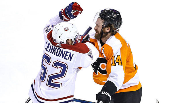 TORONTO, ONTARIO - AUGUST 19: Sean Couturier #14 of the Philadelphia Flyers is hit by Artturi Lehkonen #62 of the Montreal Canadiens during the third period in Game Five of the Eastern Conference First Round during the 2020 NHL Stanley Cup Playoffs at Scotiabank Arena on August 19, 2020 in Toronto, Ontario.