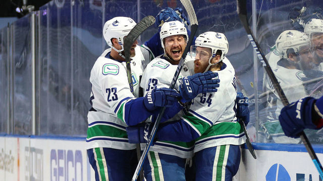 EDMONTON, ALBERTA - AUGUST 19: Tyler Motte #64 of the Vancouver Canucks celebrates with Jay Beagle #83 and Alexander Edler #23 after Motte scored in the second period of Game Five of the Western Conference First Round of the 2020 NHL Stanley Cup Playoff between the Vancouver Canucks and the St. Louis Blues at Rogers Place on August 19, 2020 in Edmonton, Alberta.