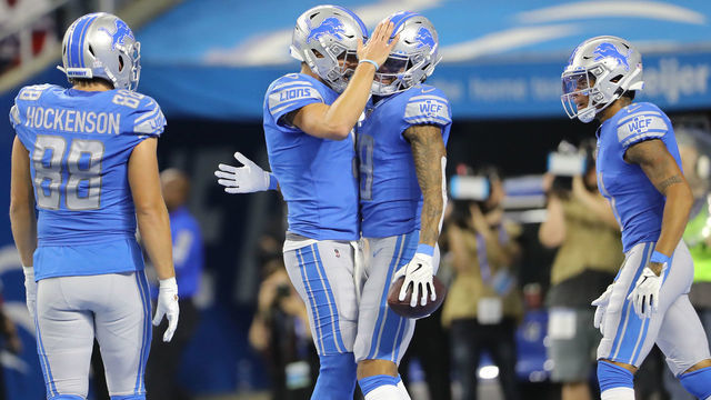 DETROIT, MI - OCTOBER 27: Kenny Golladay #19 of the Detroit Lions celebrates his touchdown pass with teammate Matthew Stafford #9 of the Detroit Lions in the third quarter against the New York Giants at Ford Field on October 27, 2019 in Detroit, Michigan.
