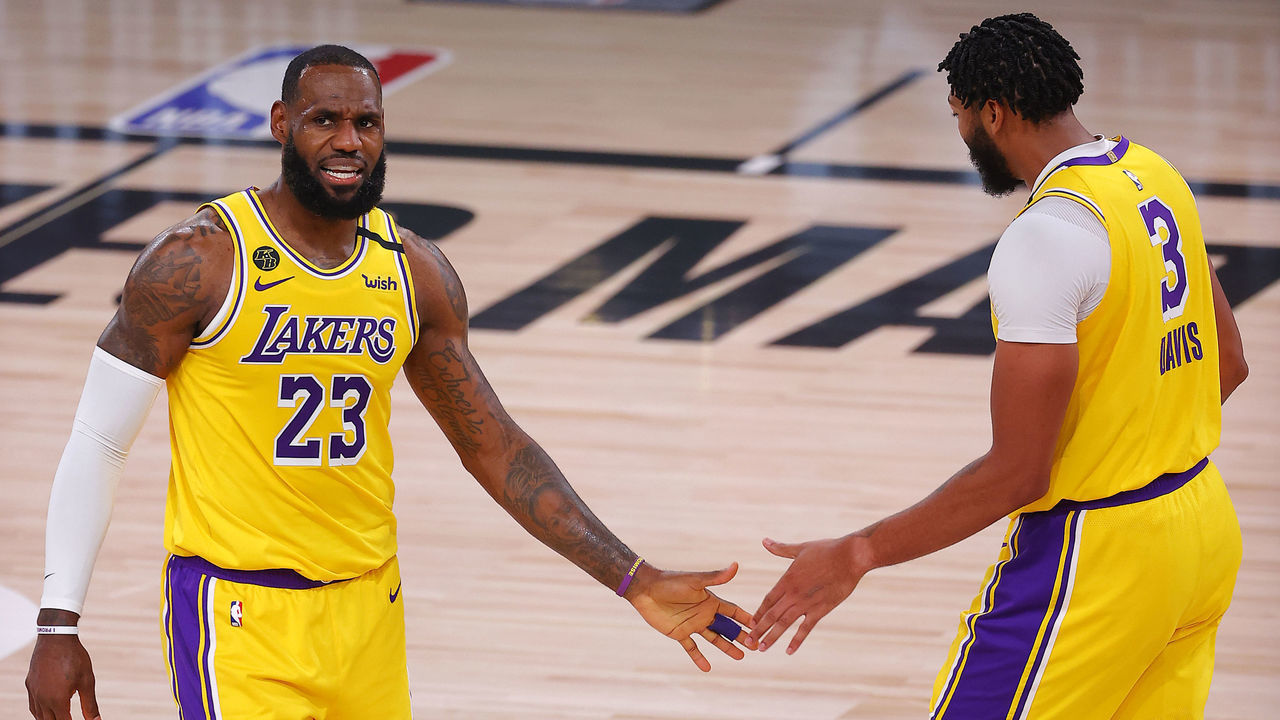 LAKE BUENA VISTA, FLORIDA - AUGUST 18: LeBron James #23 of the Los Angeles Lakers and Anthony Davis #3 of the Los Angeles Lakers react after a shot during the third quarter against the Portland Trail Blazers in Game One of the Western Conference First Round during the 2020 NBA Playoffs at AdventHealth Arena at ESPN Wide World Of Sports Complex on August 18, 2020 in Lake Buena Vista, Florida.