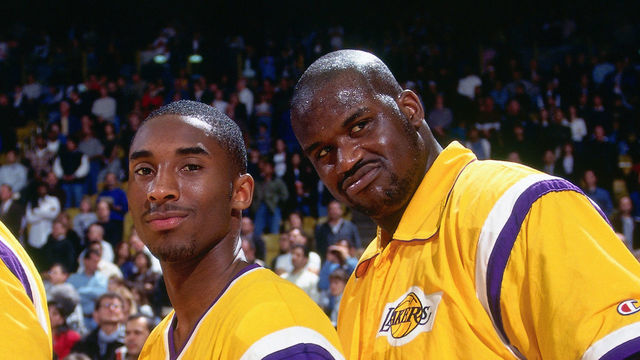 INGLEWOOD, CA - 1997: Kobe Bryant #8 and Shaquille O'Neal #32 of the Los Angeles Lakers pose during the National Anthem during a game circa 1997 at the Great Western Forum in Inglewood, California. Mandatory Copyright Notice: Copyright 1997 NBAE