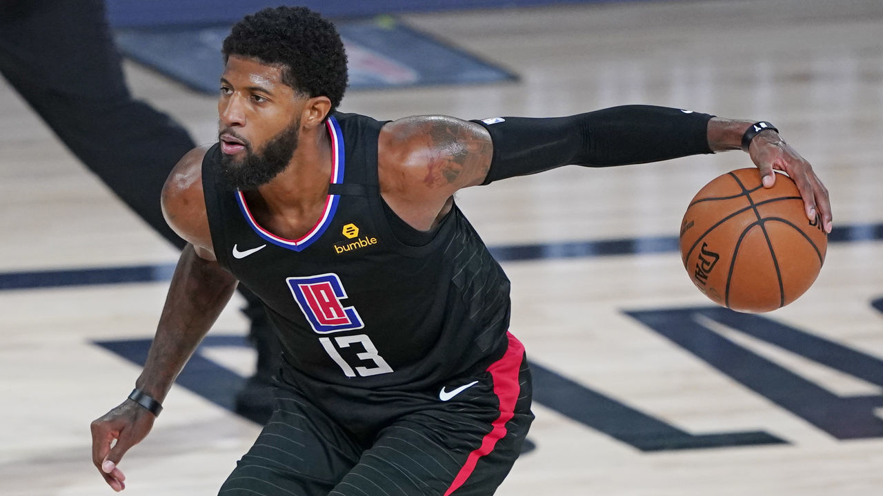 LAKE BUENA VISTA, FLORIDA - AUGUST 19: Paul George #13 of the LA Clippers moves the ball against the Dallas Mavericks during the second half in game two of the first round of the NBA playoffs at AdventHealth Arena at ESPN Wide World Of Sports Complex on August 19, 2020 in Lake Buena Vista, Florida.