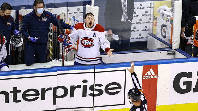 TORONTO, ONTARIO - AUGUST 19: Brendan Gallagher #11 of the Montreal Canadiens complains to referee Kyle Rehman #10 as he bleeds from the mouth for the lack of a penalty call against the Philadelphia Flyers during the third period in Game Five of the Eastern Conference First Round during the 2020 NHL Stanley Cup Playoffs at Scotiabank Arena on August 19, 2020 in Toronto, Ontario.