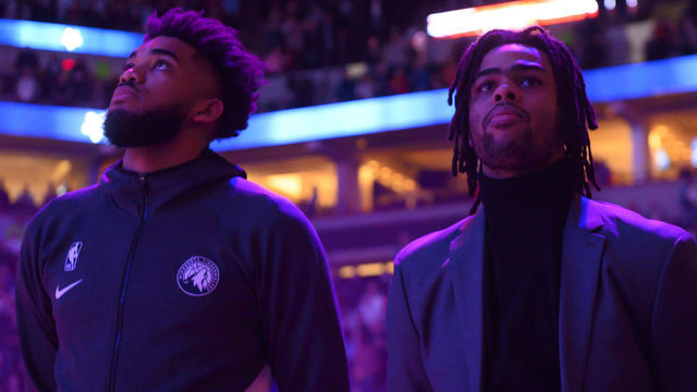 MINNEAPOLIS, MN - FEBRUARY 8: Minnesota Timberwolves center Karl-Anthony Towns (32) stood beside guard D'Angelo Russell (0) for the national anthem before an NBA game against the LA Clippers at Target Center on Saturday, Feb. 8, 2020.